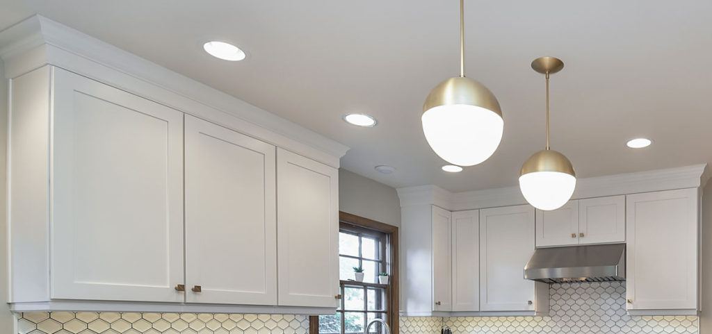 White cabinets are generally more desirable to buyers than old oak cabinets.