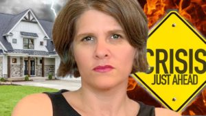 somber face thinking about the 2023 raleigh housing market. sign says Crisis ahead. Lightening and fire engulf a house.