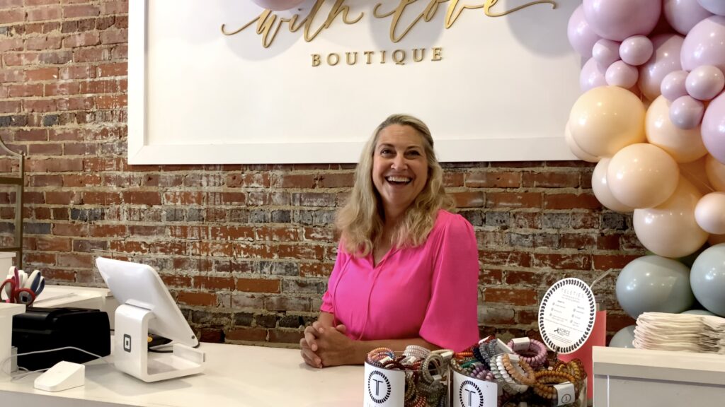 Store clerk in women's boutique, downtown Sanford, NC